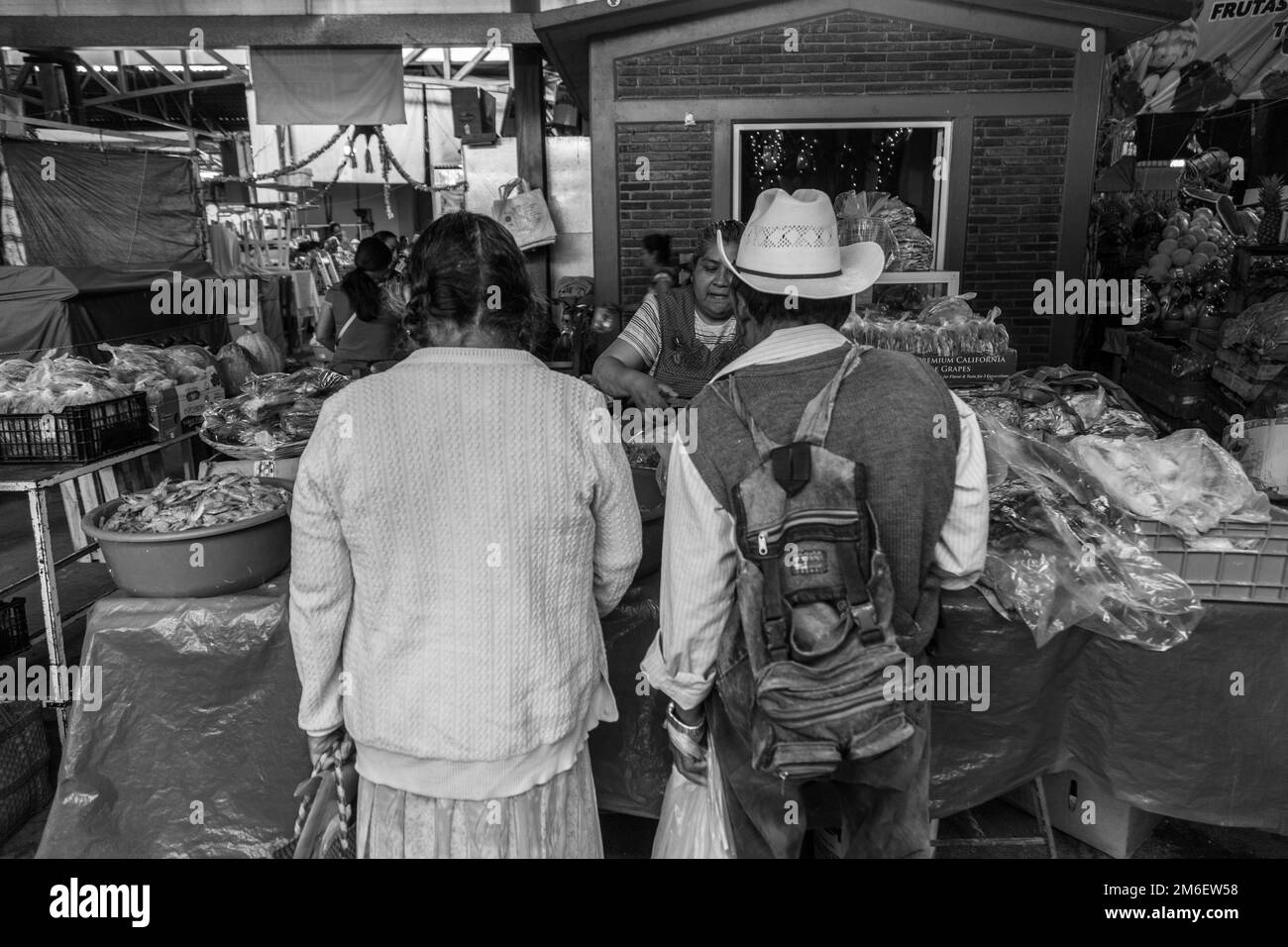 couple doing grocery at the local market in Oaxaca. Mexico Stock Photo