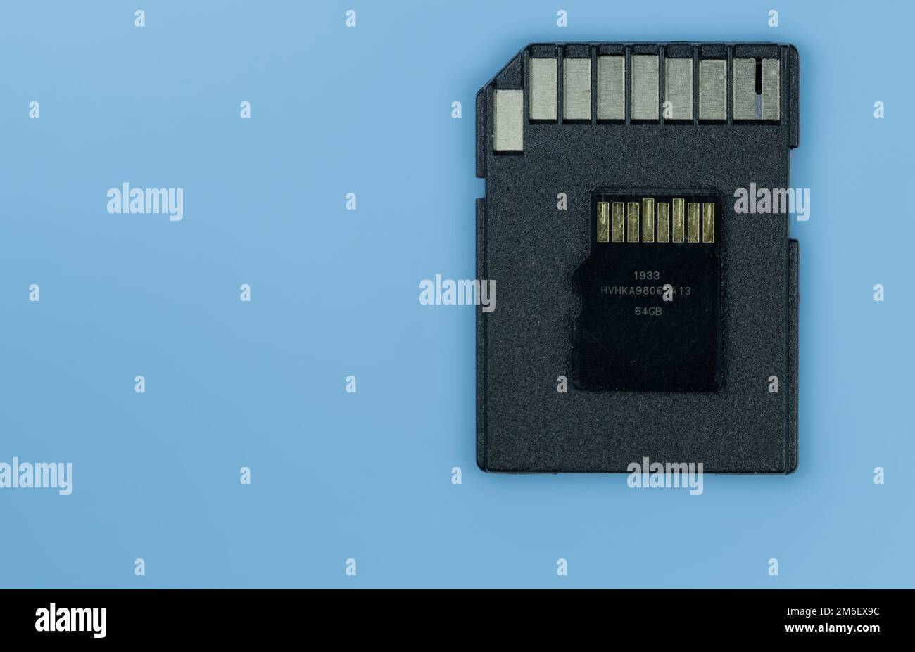 A sd memory card and micro sd on blue background Stock Photo