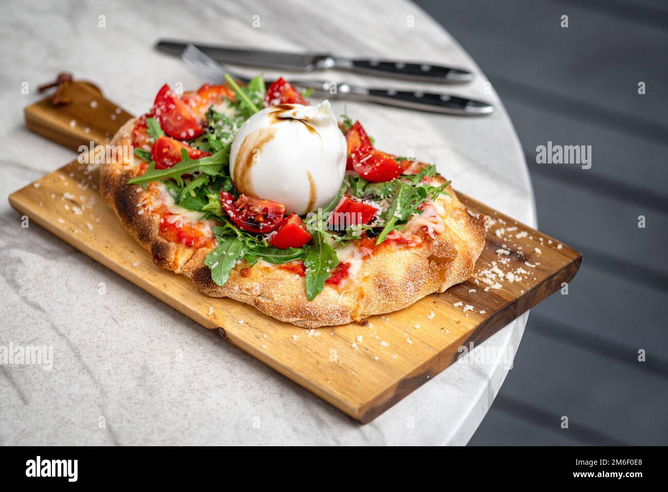 Italian focaccia with burrata and zucchini flower with tomatoes cherry