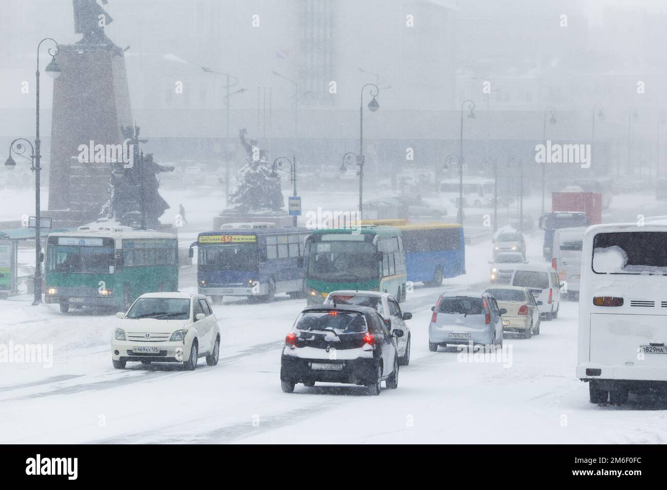 January, 2016 - Vladivostok, Russia - Heavy snowfall in Vladivostok. Cars drive during snowfall along the central streets of Vla Stock Photo