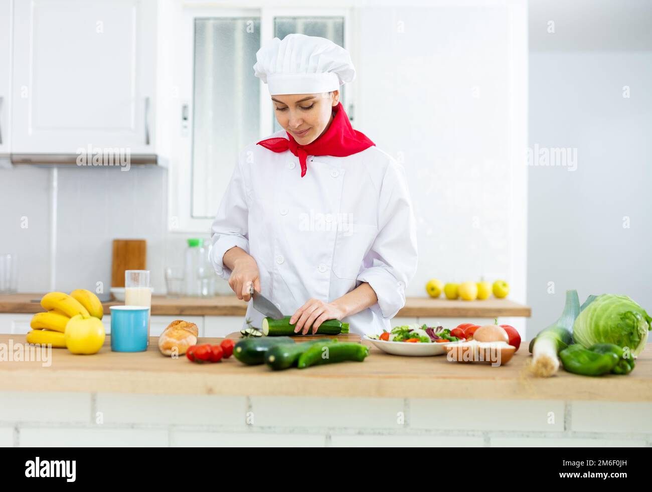 Woman Chopping Vegetables - Stock Image - F003/5963 - Science Photo Library
