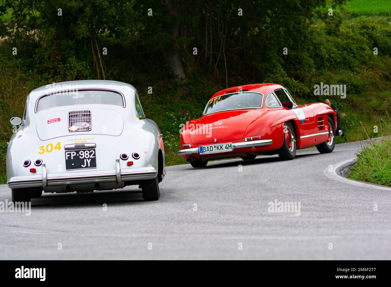 MERCEDES-BENZ 300 SL W 198 1955 PORSCHE 356 1600 COUPÃ‰ 1956 on an old racing car in rally Mille Miglia 2020 the famous italian Stock Photo