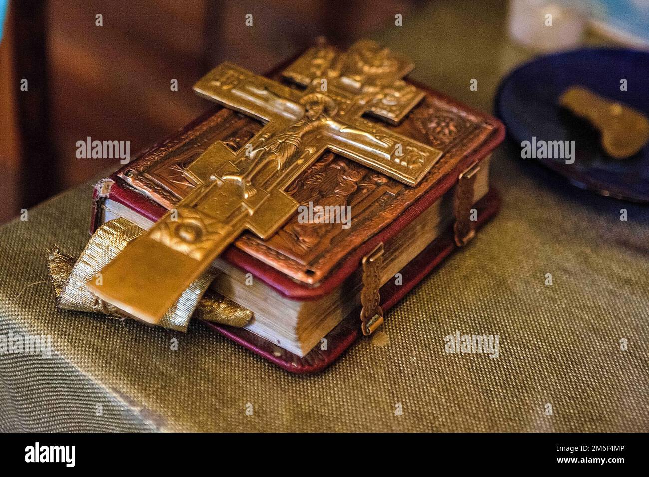 Old bible with a lock on the binding and a cross is on the book Stock