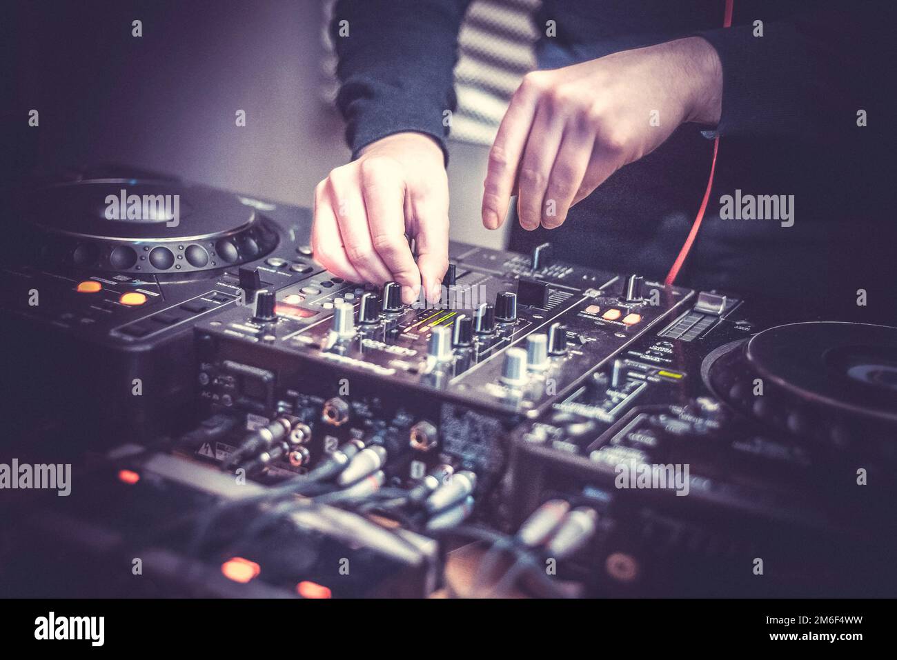 DJ at the remote control. Mixer remote at concert. Musical equipment. Stock Photo