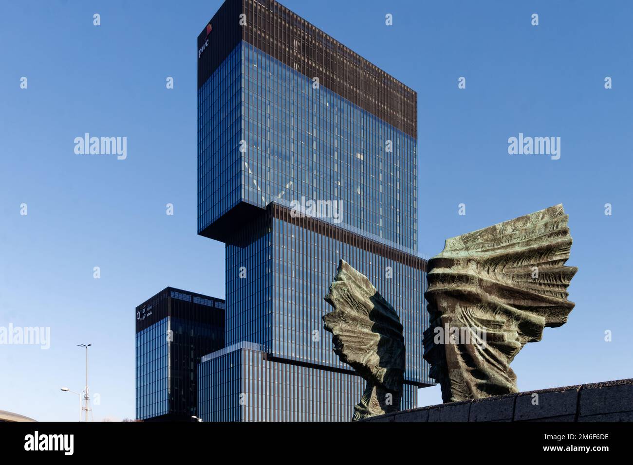 KTW office complex designed by Medusa Group (left), and the Silesian Uprisings memorial (wings, right) by sculptor Gustaw Zemla. Stock Photo