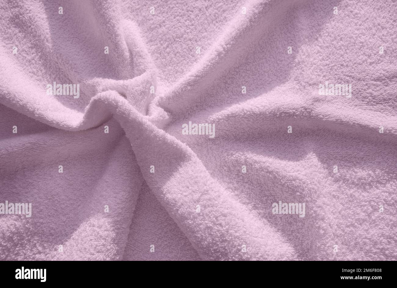 Pink fluffy Terry towel, a simple example of the texture of a soft
