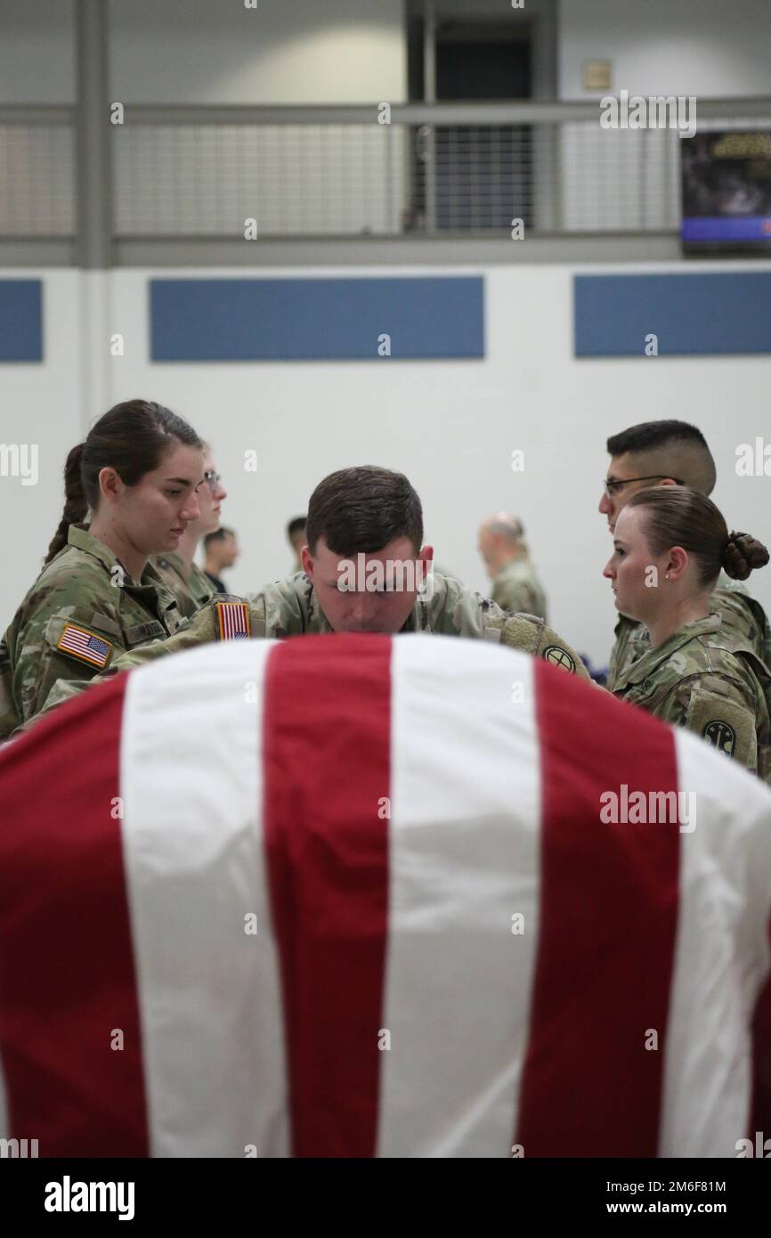 Army Spc. Stephen Drolet, a Soldier in the Massachusetts National Guard,  takes aim with a rifle during the 80-hour, Train-the-trainer Military  Funeral Honors course at Camp Smith Training Site May 11, 2017.