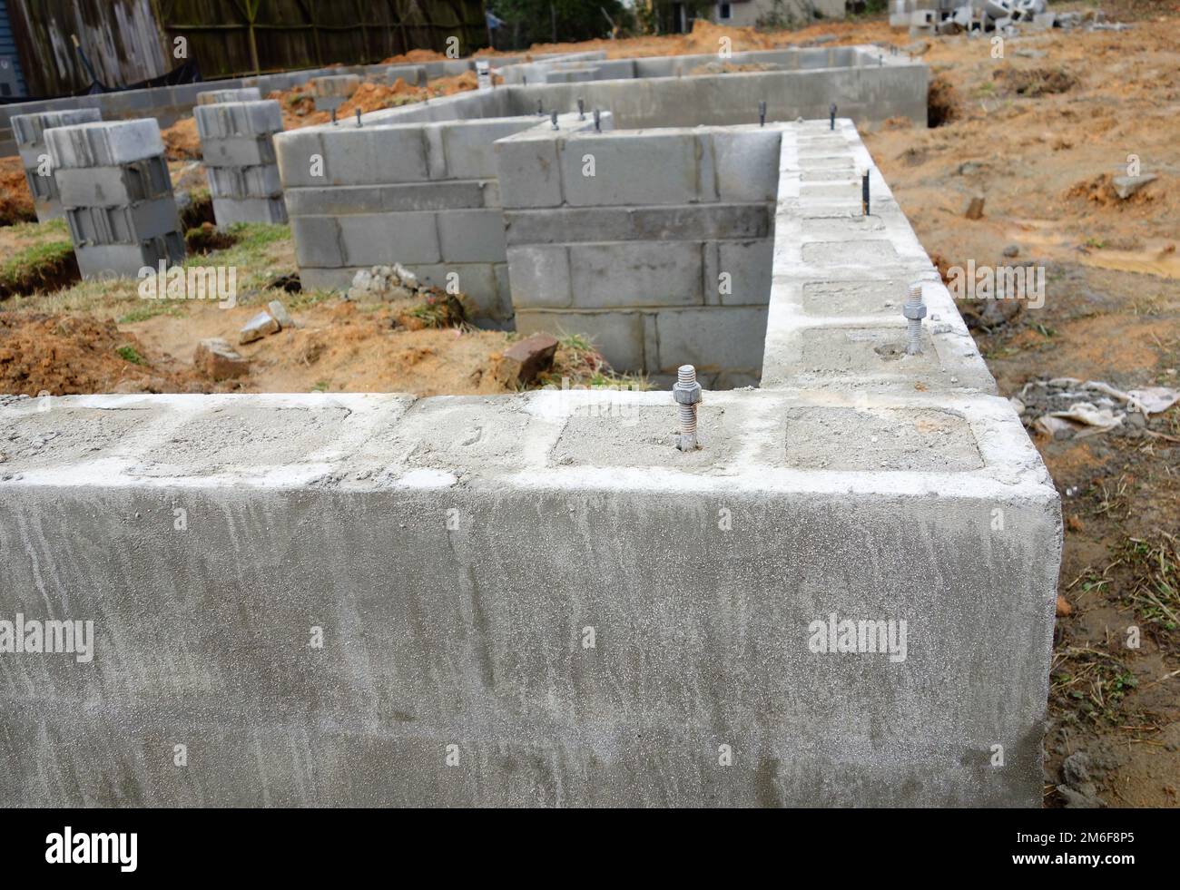 Cinder block foundation being built for new home construction Stock Photo
