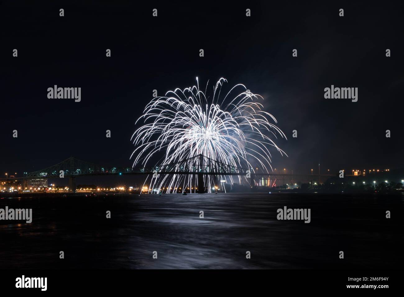 Fireworks. Jacques-Cartier Montreal. Fireworks with reflection on water.Fireworks background and space for text.Fireworks in the sky.Panorama firework Stock Photo