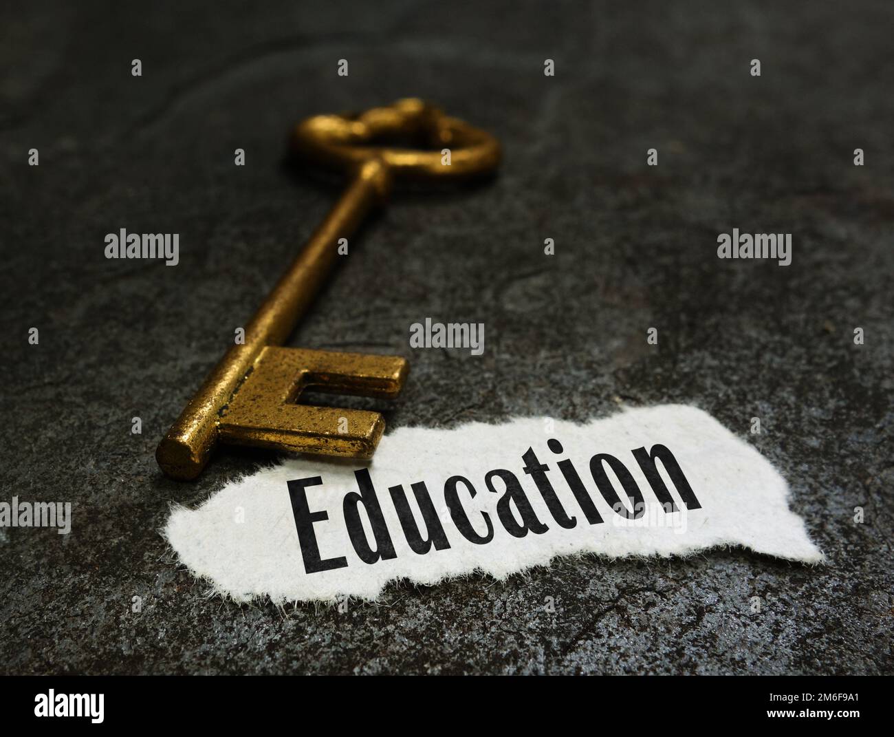 Education message with gold key Stock Photo