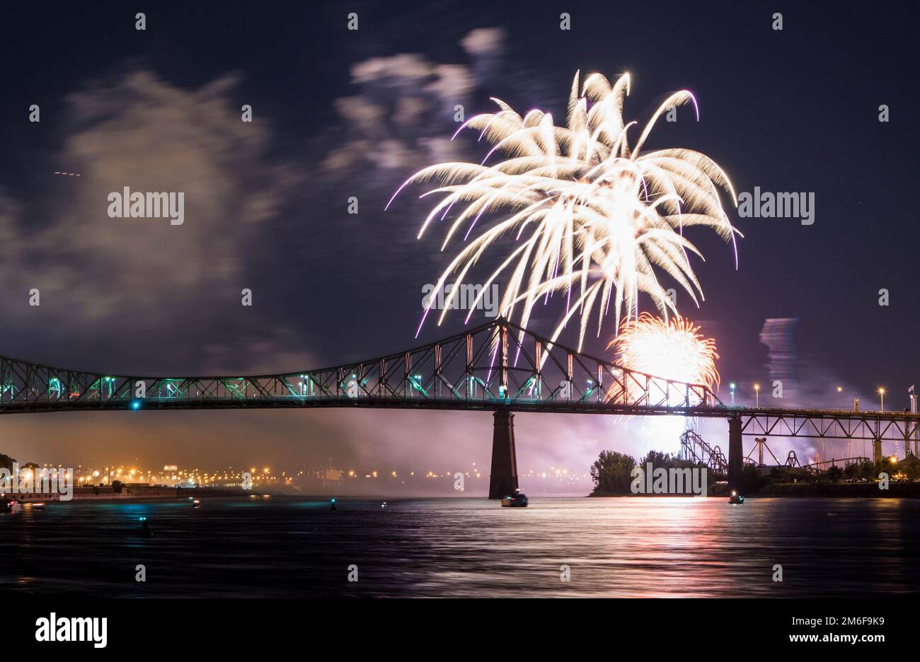 Fireworks. Jacques-Cartier Montreal. Fireworks with reflection on water.Fireworks background and space for text.Fireworks in the sky.Panorama firework Stock Photo