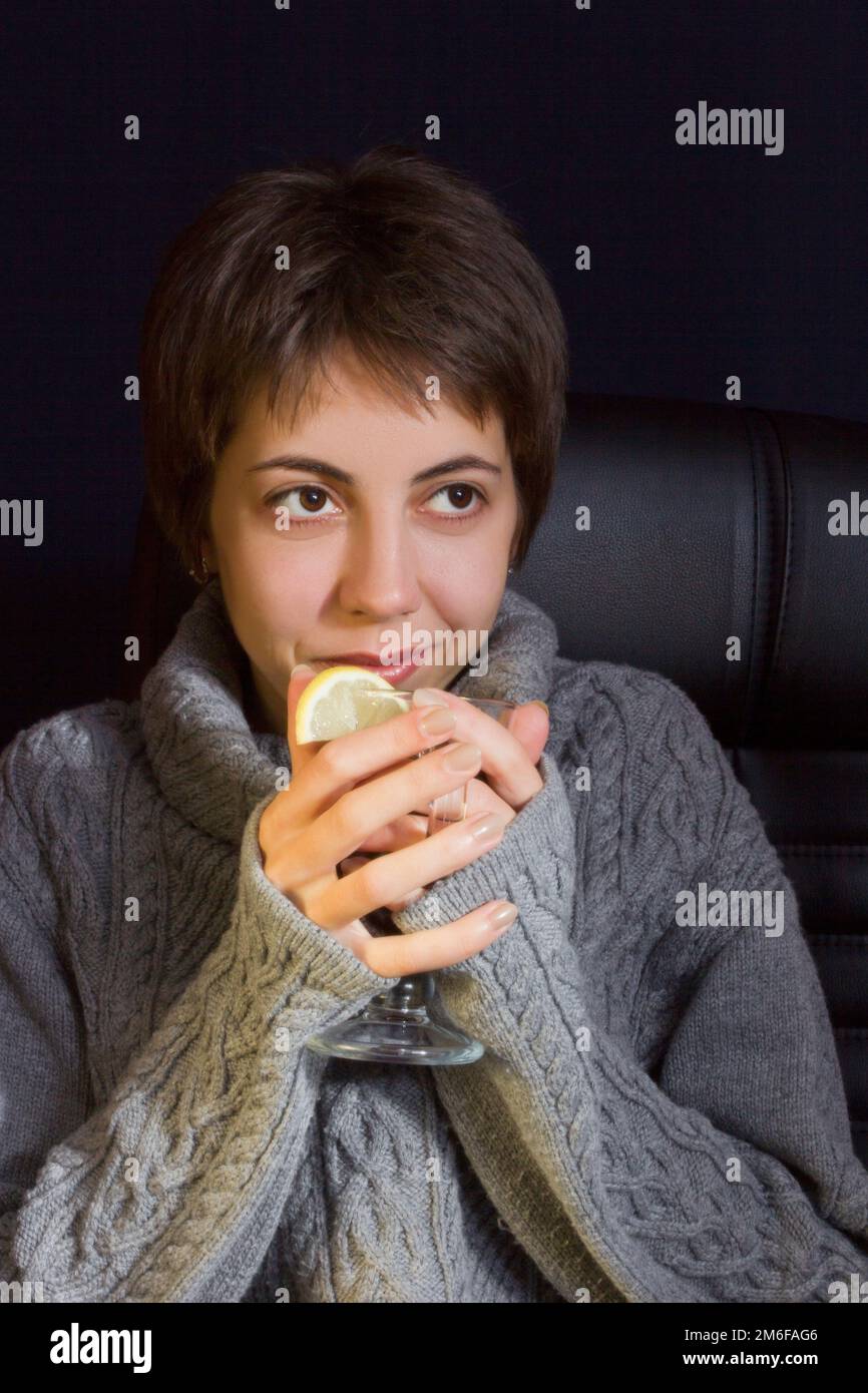 Young woman with hot drink Stock Photo