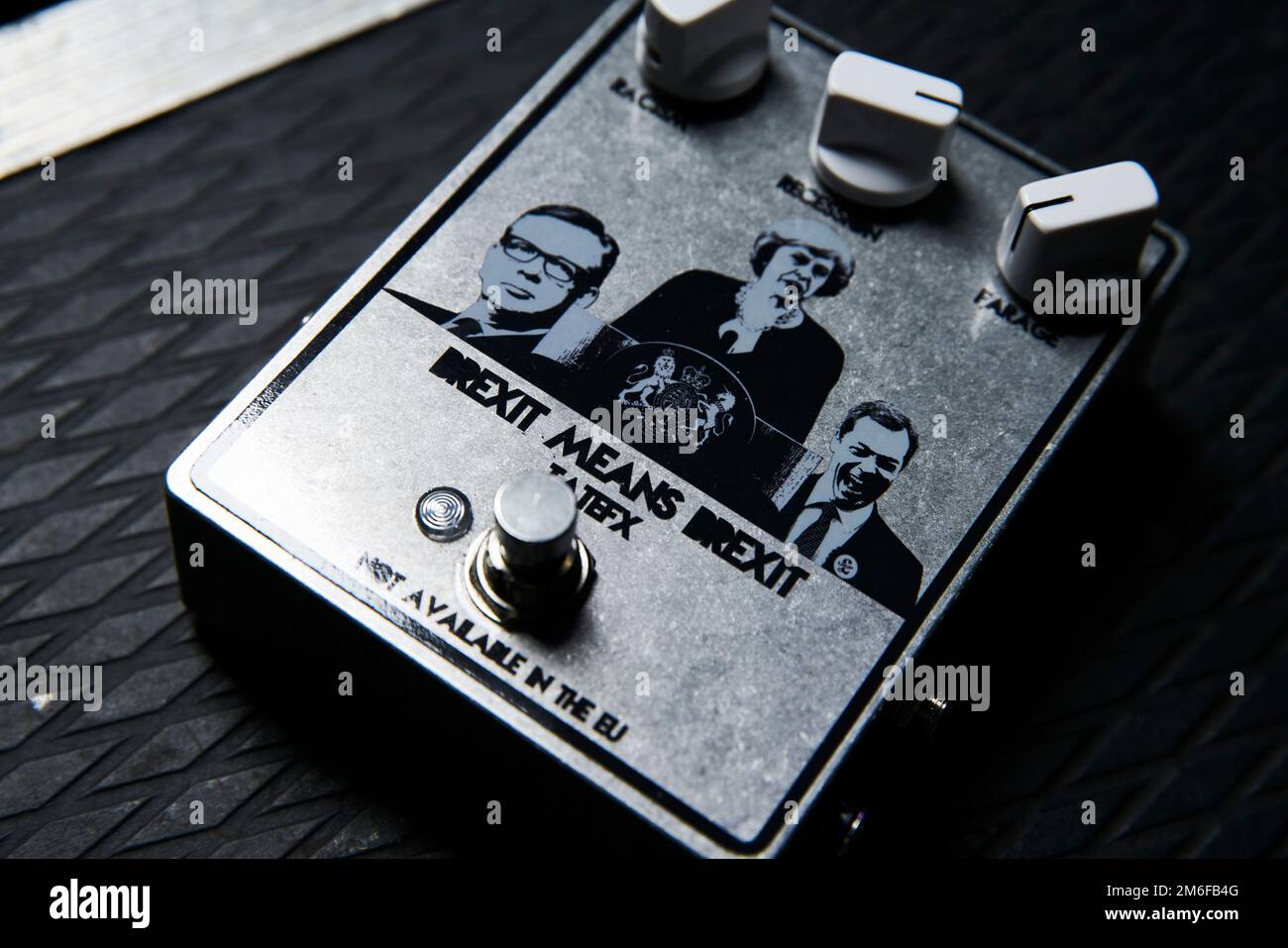 Mikey from Skindred's Brexit Means Brexit guitar effect pedal with images of Michael Gove, Theresa May, and Nigel Farage. Stock Photo