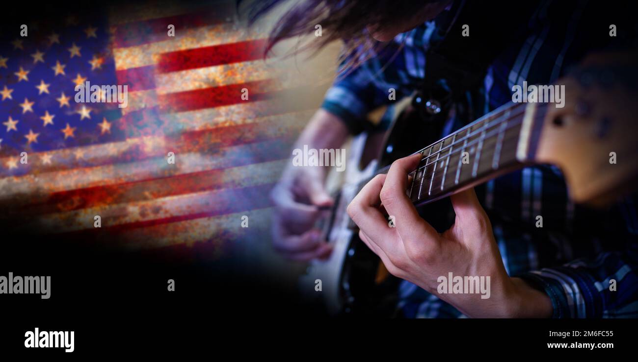 Electric guitar man playing on US flag background Stock Photo