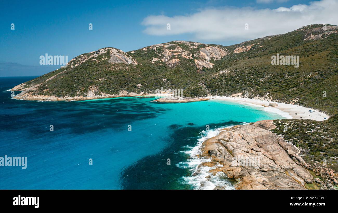 Beautiful image of turquoise colour water, little beach, and mountain range in Two Peoples Bay, Albany, Western Australia Stock Photo