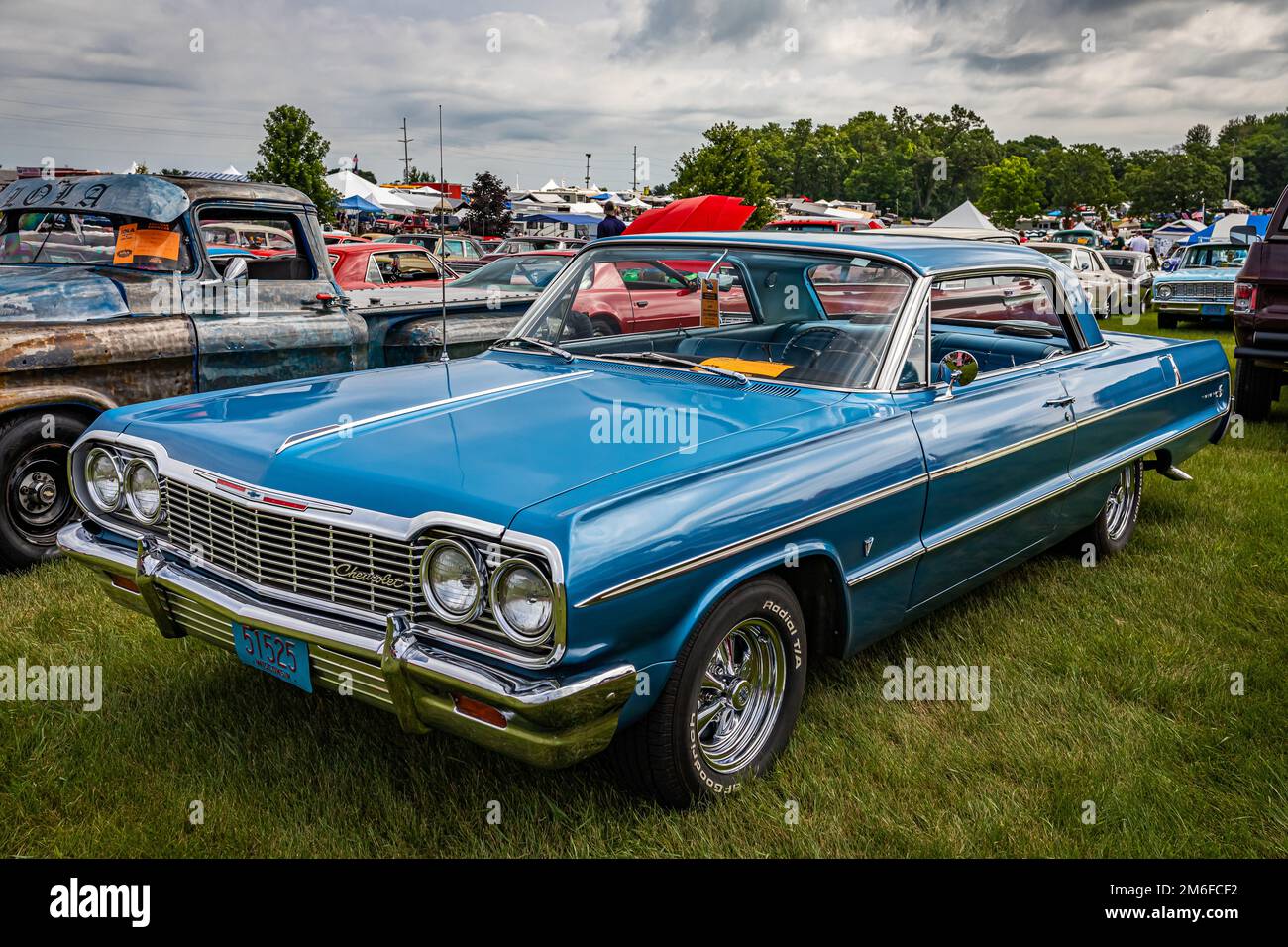 Iola, WI - July 07, 2022: High perspective front corner view of a 1964 Chevrolet Impala Sport Coupe at a local car show. Stock Photo