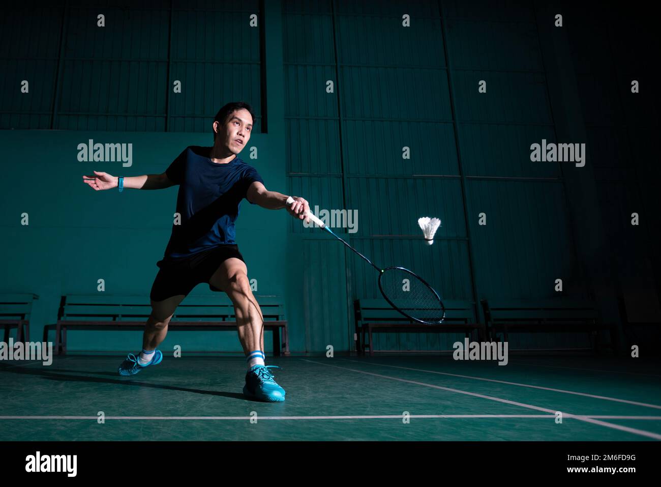 professional badminton player use racquet hit shuttle cock or shuttlecock  on court during warm up play before tournament competition in single man  Stock Photo - Alamy