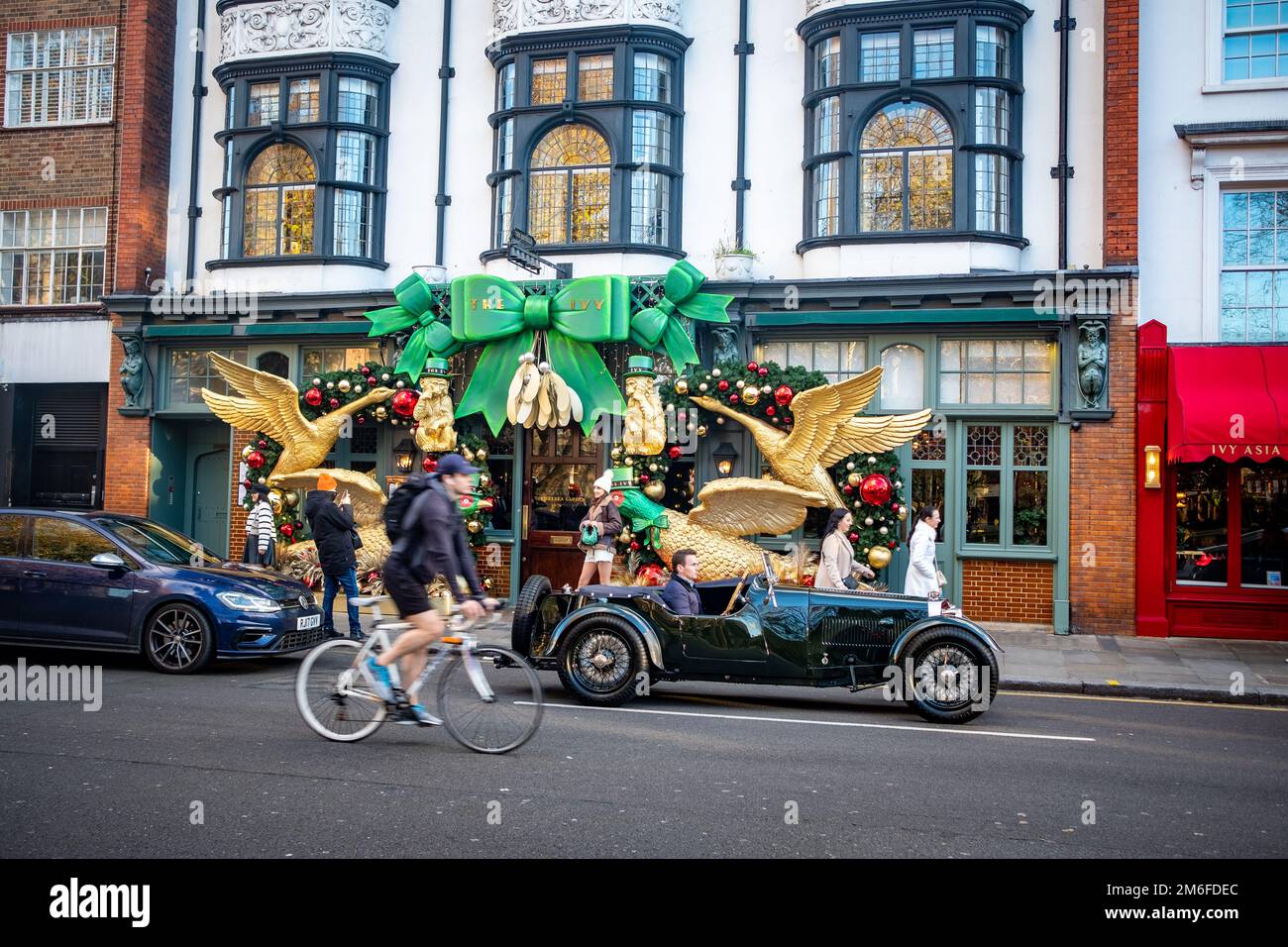 London - December 2022: The Ivy on Kings Road Chelsea with seasonal decorations adorning the entrance Stock Photo