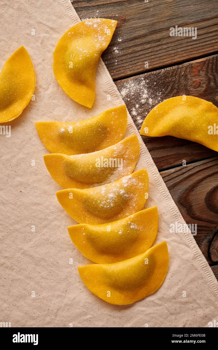 Raw homemade ravioli pasta with spinach and ricotta Stock Photo - Alamy