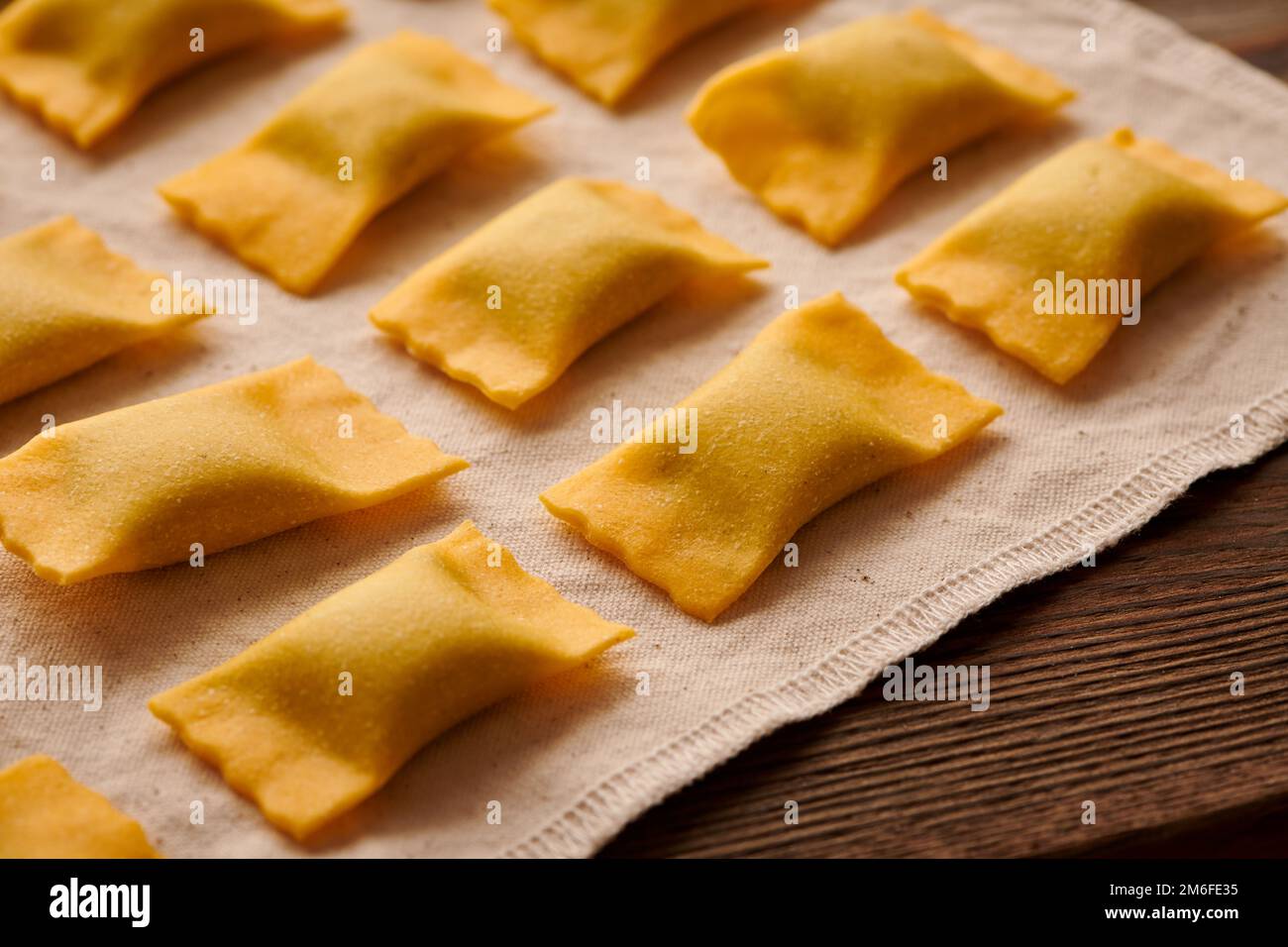 Raw homemade ravioli pasta with spinach and ricotta Stock Photo - Alamy