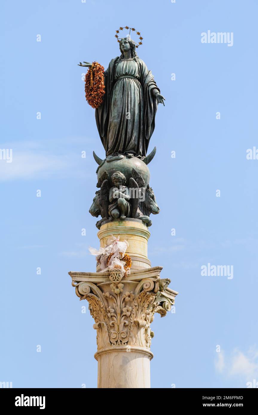 The Column of the Immaculate Conception, is a nineteenth-century monument depicting the Blessed Virgin Mary, located in Piazza M Stock Photo