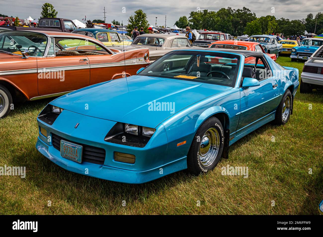 Iola, WI - July 07, 2022: High perspective front corner view of a 1990 Chevrolet Camaro RS Coupe at a local car show. Stock Photo