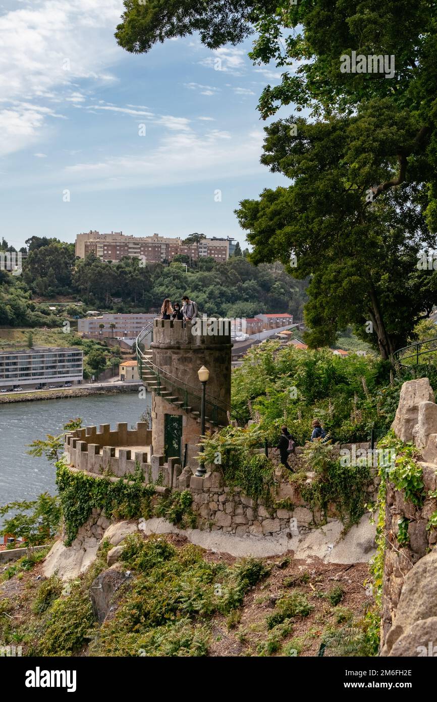 People in a Little Tower Lookout - Douro River View from a Beautiful Garden in the Park - PalÃ¡cio de Cristal, Porto, Portugal Stock Photo