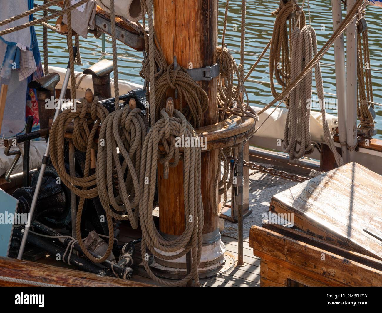 Large thick ropes on the mast of a large sailing ship Stock Photo