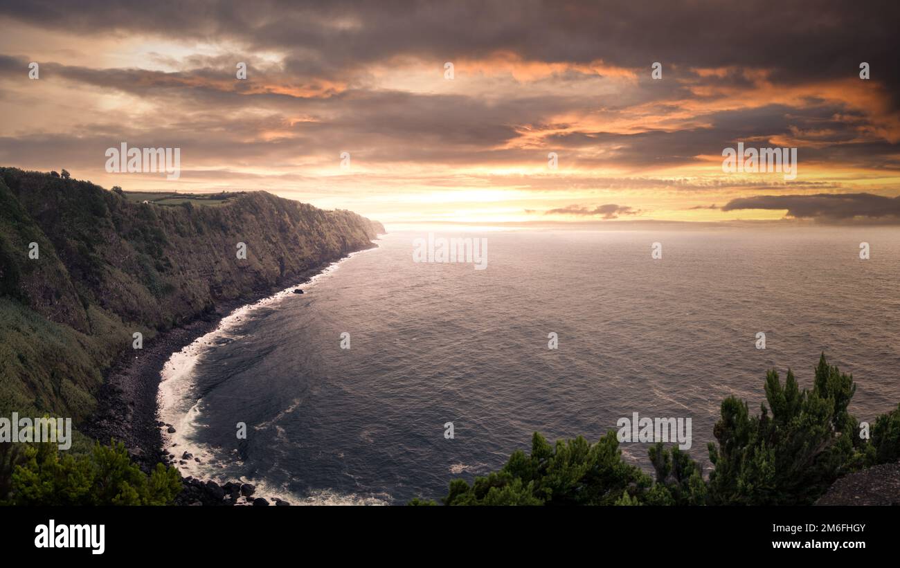 Sunset by the sea Stock Photo - Alamy