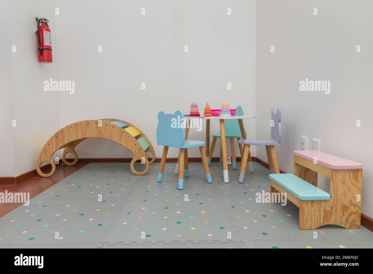 Children's play area in a pediatric office, with tables, chairs and games for children. Stock Photo