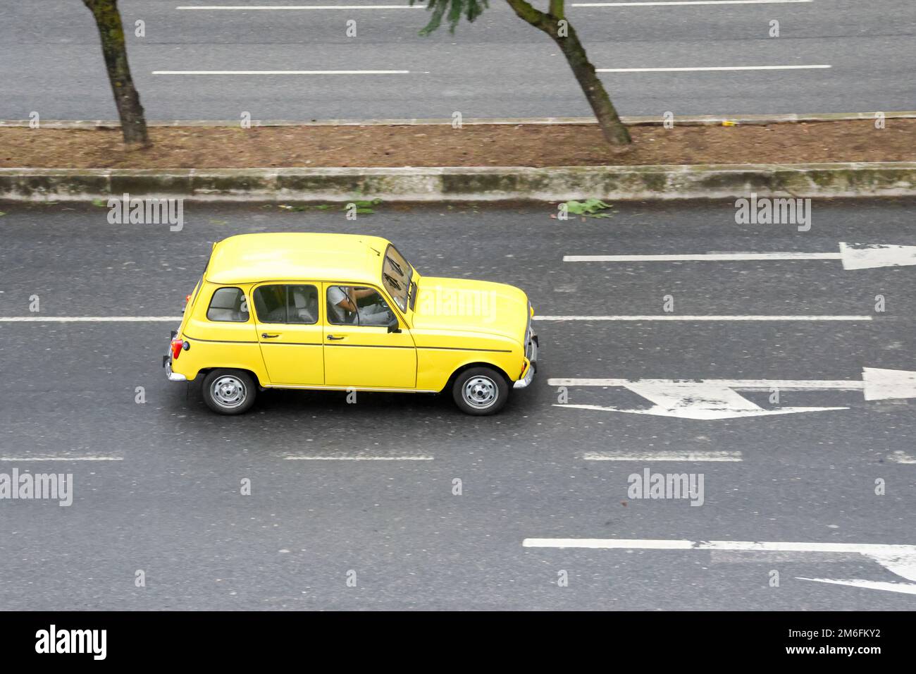 The Historic vehicle from the manufacturer Renault model 4L in yellow color Stock Photo