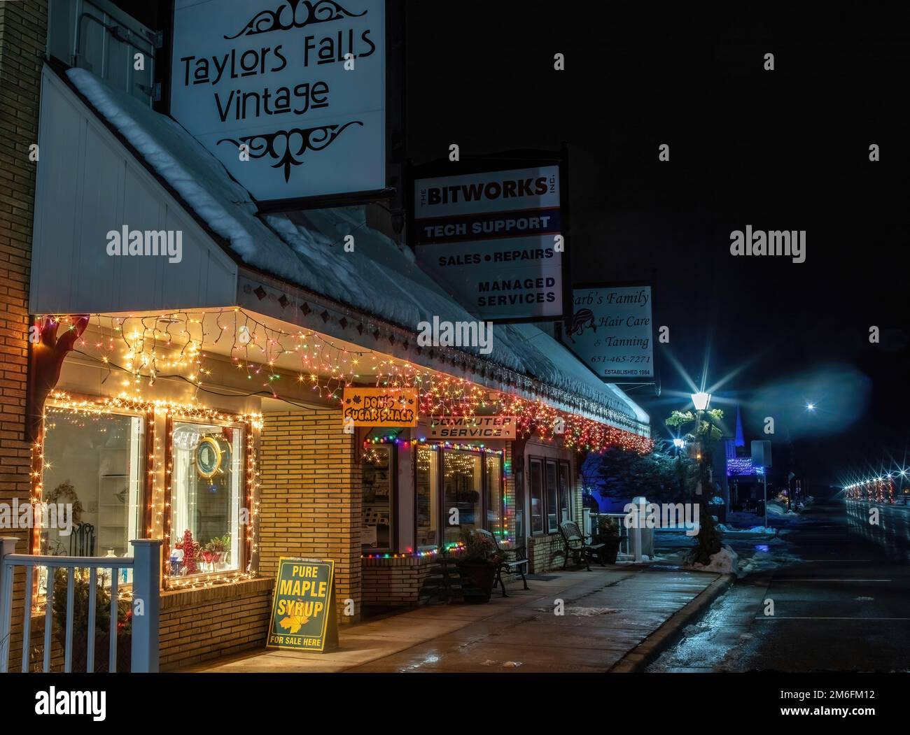1956 Harold Anderson building storefronts decorated with Christmas