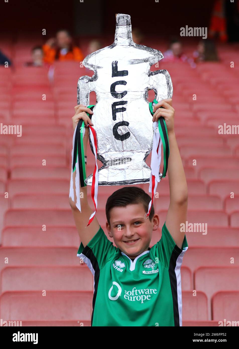 A young Lincoln City fan with a tin foil FA cup ahead of the match - Arsenal v Lincoln City, The Emirates FA Cup Quarter-final, Emirates Stadium, London - 11th March 2017. Stock Photo