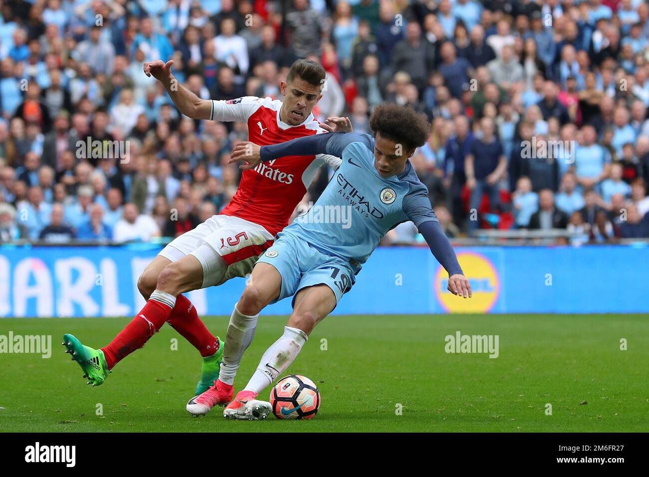 Leroy Sane of Manchester City and Gabriel Paulista of Arsenal - Arsenal v Manchester City, The Emirates FA Cup Semi Final, Wembley Stadium, London - 23rd April 2017. Stock Photo