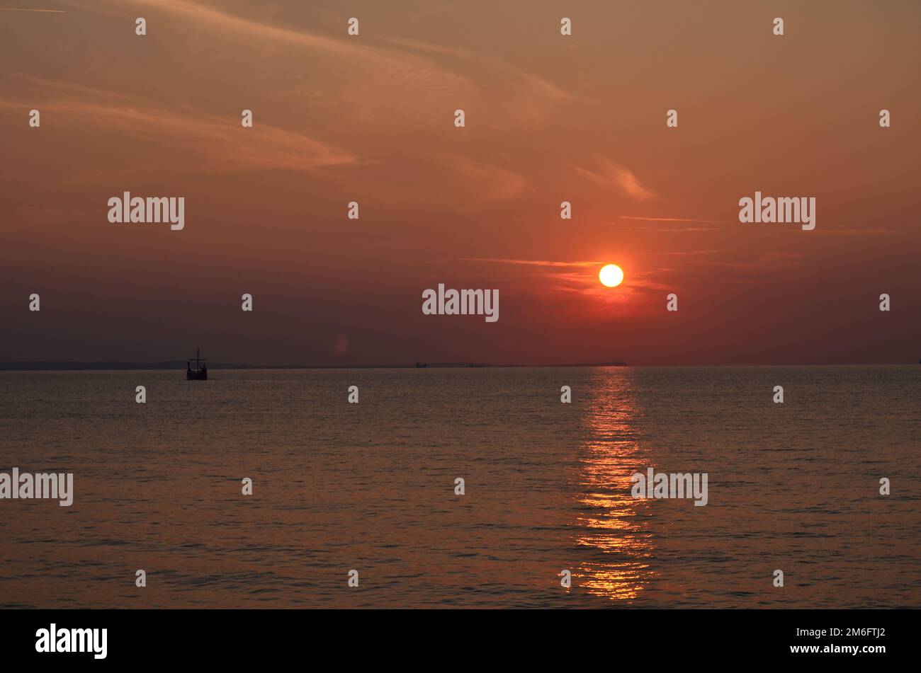 Sunset over the baltic sea in Międzyzdroje with viking boat Stock Photo ...