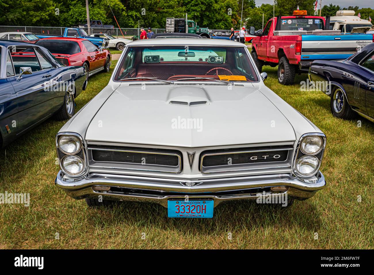 Iola, WI - July 07, 2022: High perspective front view of a 1965 Pontiac GTO 2 Door Hardtop at a local car show. Stock Photo