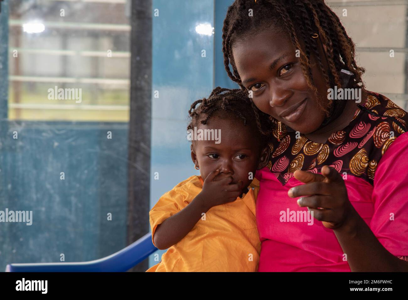 A child and her mother await treatment at 14 Military Hospital in Monrovia, Liberia, April 27, 2022. MING's State Partnership Program with Liberia was on full display as various medial units conducted a medical 'best practices' exchange in Monrovia April 25-29, 2022, at the hospital. Together with the AFL, MING helped establish the facility in September 2021, making it the country's first military hospital. Stock Photo