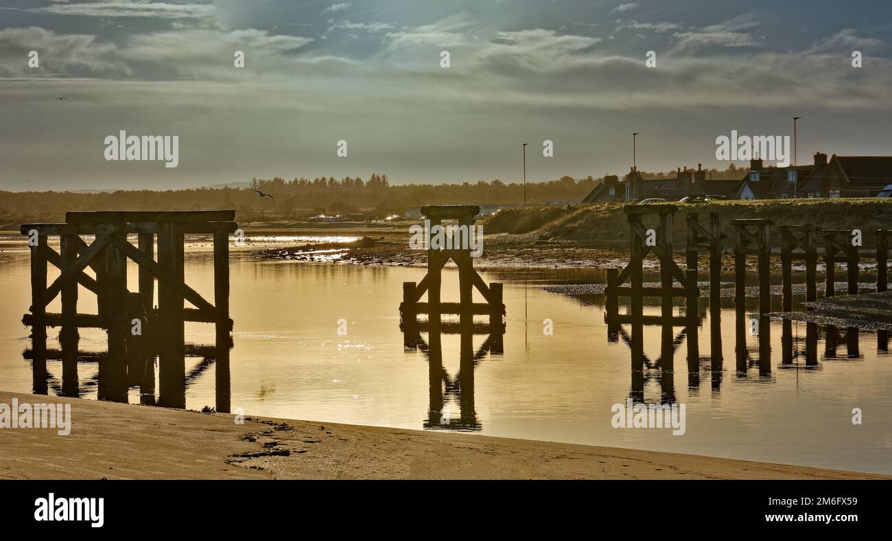 Lossiemouth  Moray coast Scotland remains of the old wooden bridge over the River Lossie Stock Photo