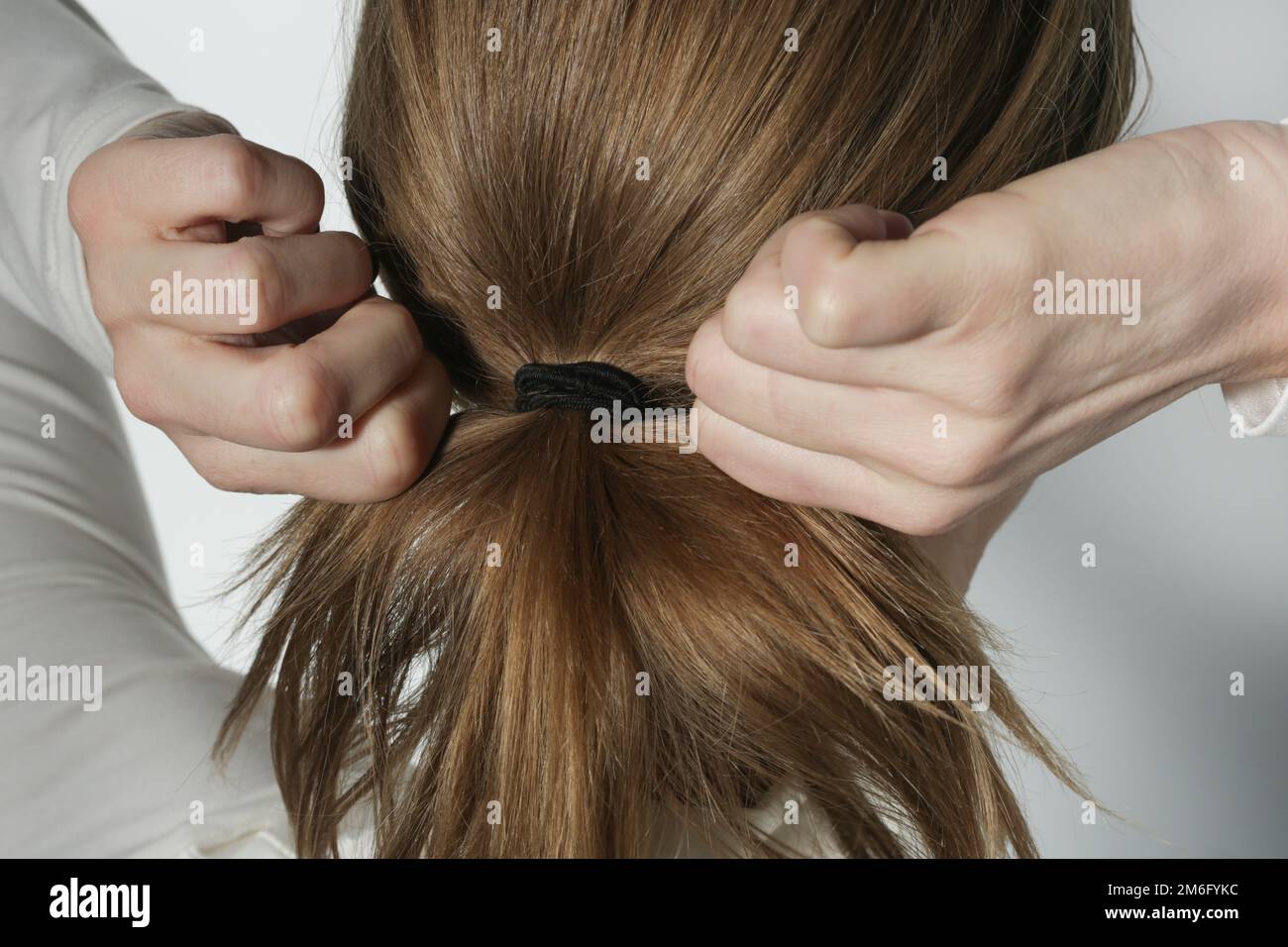 Brown hair tied in a ponytail hires stock photography and images Alamy