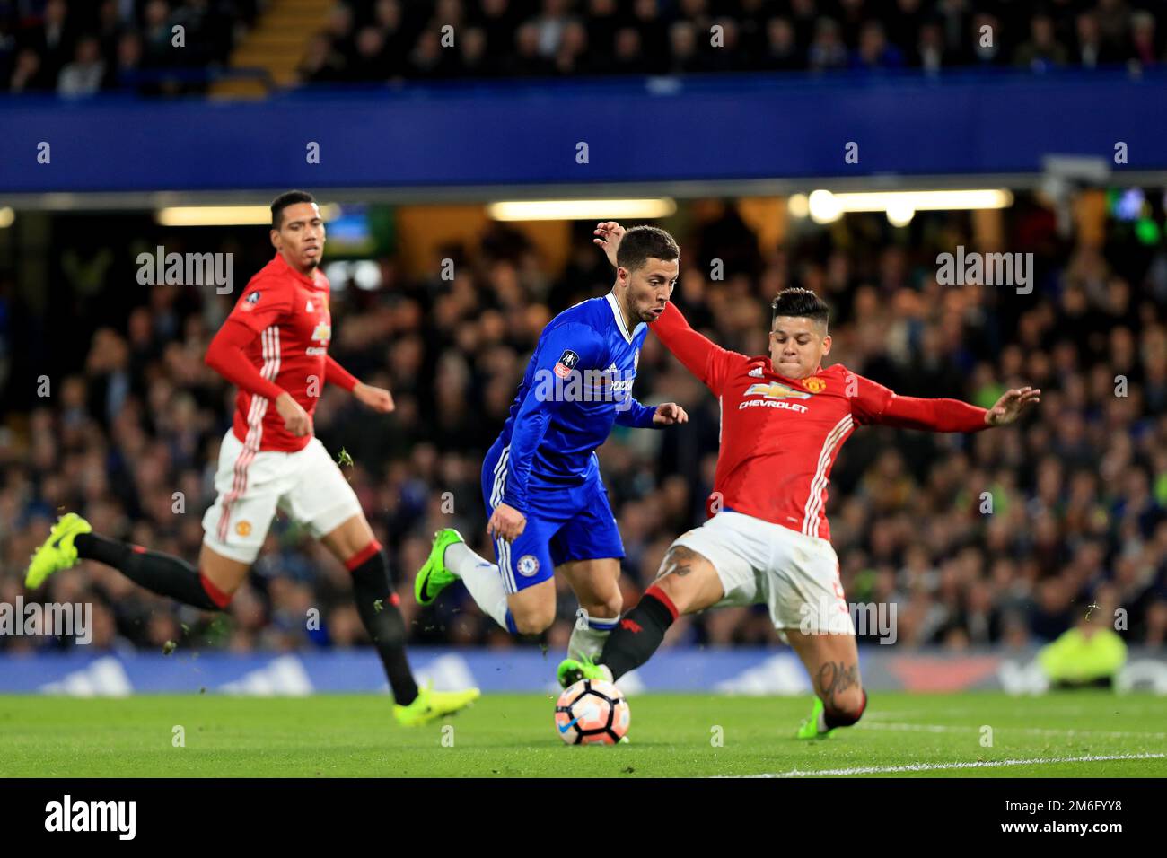 Marcos Rojo of Manchester United challenges Eden Hazard of Chelsea - Chelsea v Manchester United, FA Cup Quarter-final, Stamford Bridge, London - 13th March 2017. Stock Photo