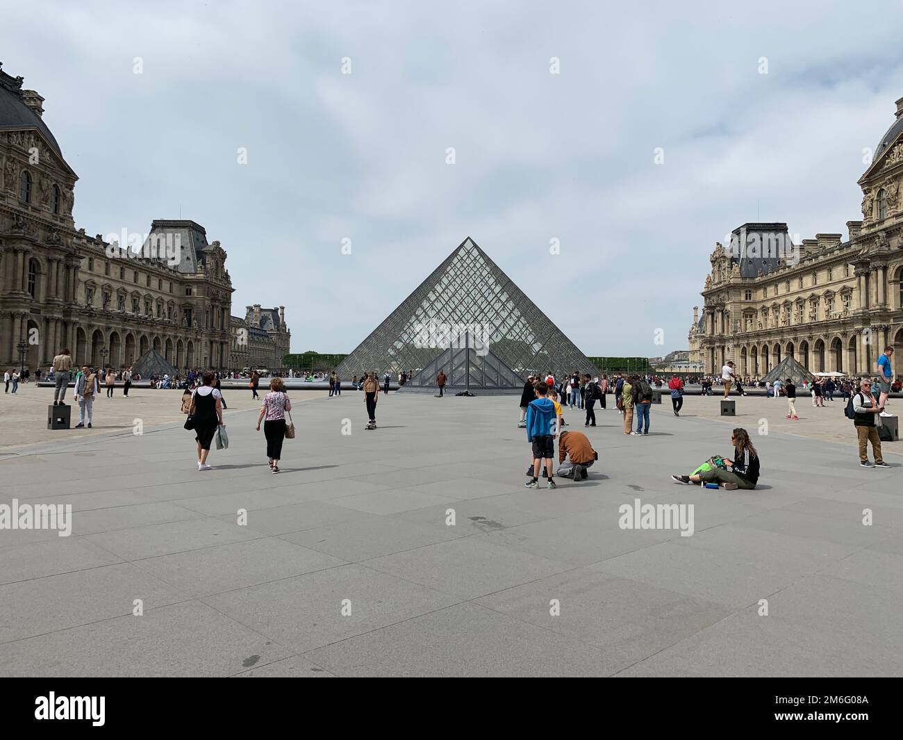 A quiet day near The Louvre Pyramid, Paris, a large glass and metal structure Stock Photo