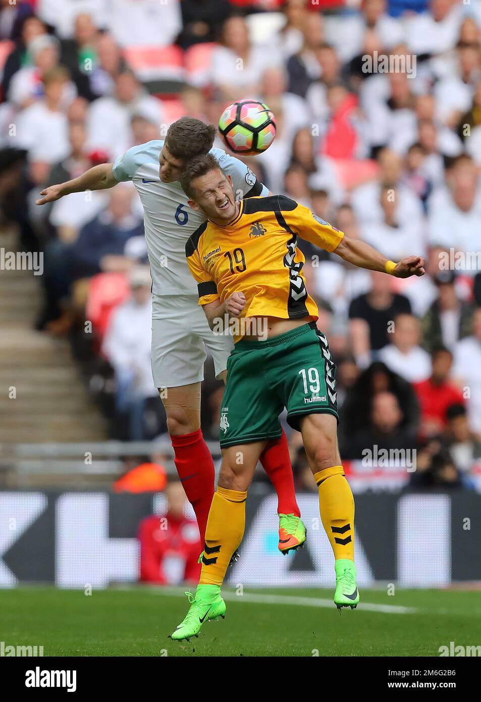 John Stones of England battles with Nerijus Valskis of Lithuania - England v Lithuania, FIFA 2018 World Cup Qualifying Group F, Wembley Stadium, London - 26th March 2017. Stock Photo