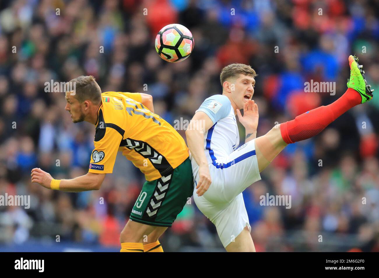John Stones of England battles with Nerijus Valskis of Lithuania - England v Lithuania, FIFA 2018 World Cup Qualifying Group F, Wembley Stadium, London - 26th March 2017. Stock Photo