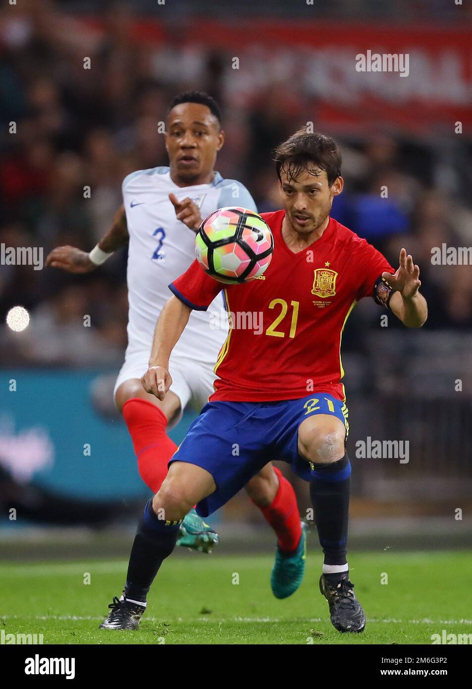 David Silva of Spain controls the ball with Nathaniel Clyne of England in pursuit - England v Spain, International Friendly, Wembley Stadium, London - 15th November 2016. Stock Photo