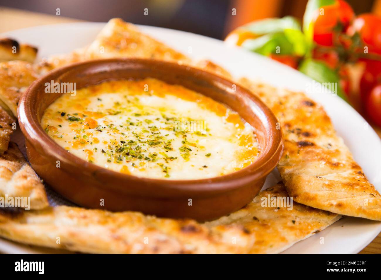 Grilled provolone. Provolone is an Italian cheese. It is an aged pasta