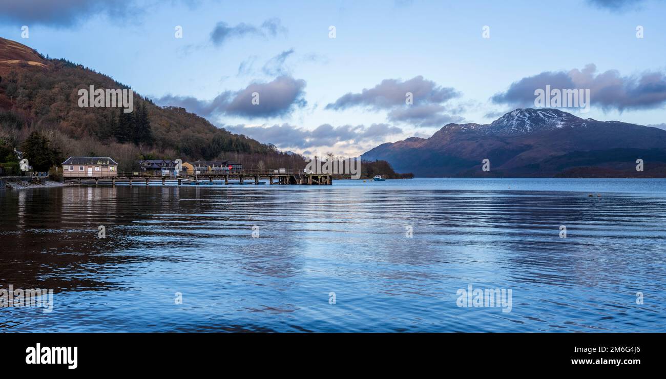 Panoramic view of Luss Pier on Loch Lomond, with Ben Lomond dominating