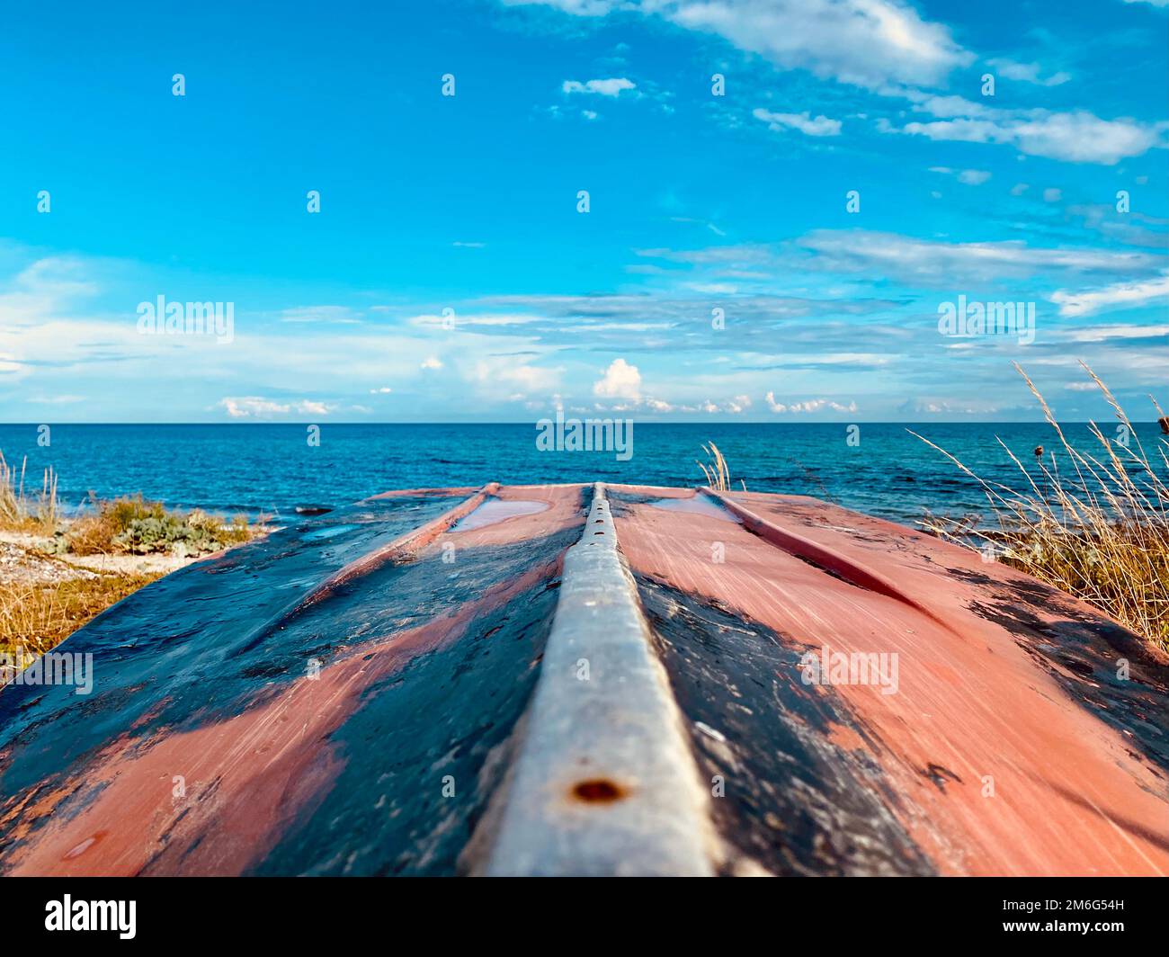 Boat lying on the beach during the summer months Stock Photo - Alamy