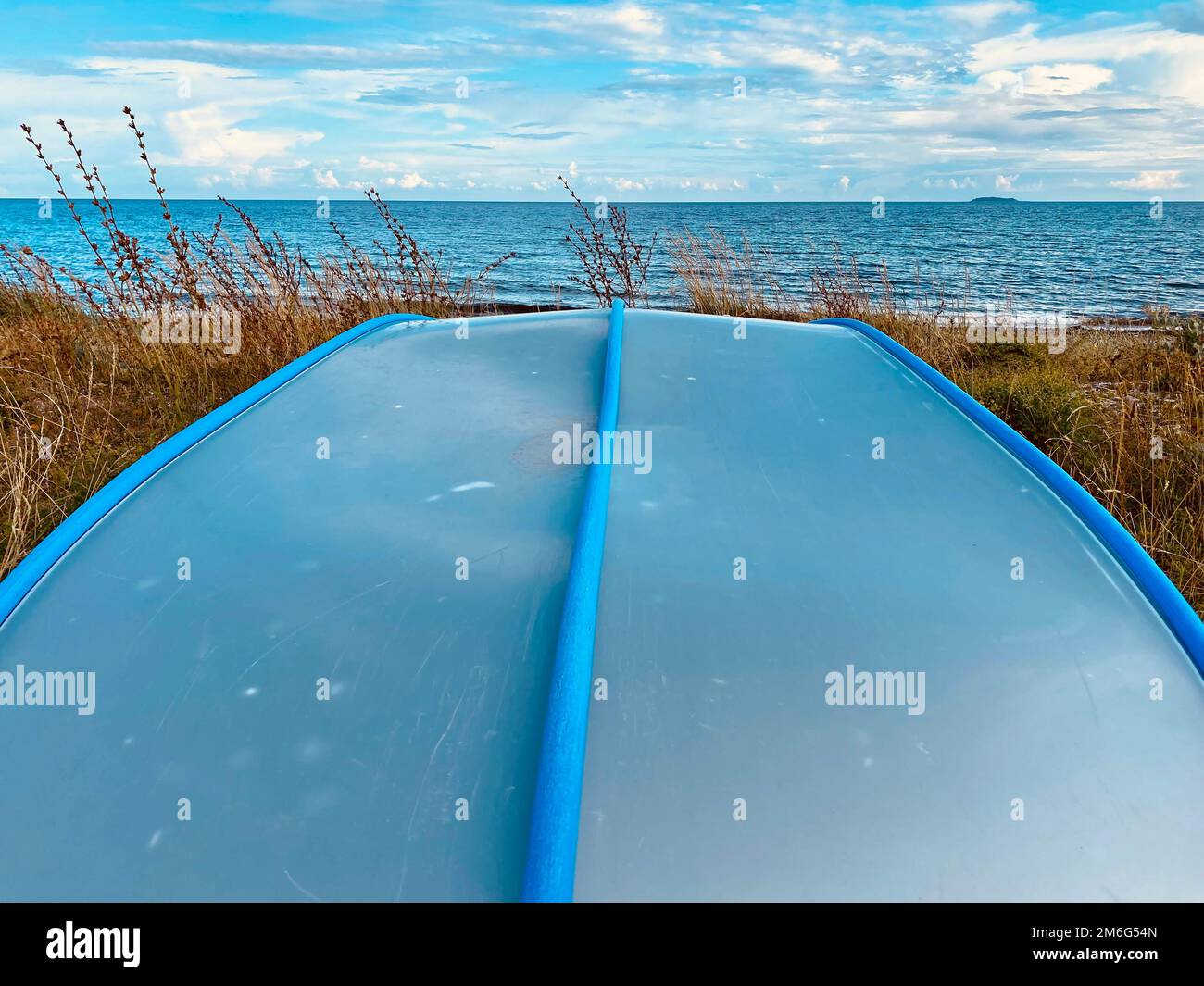 Boat lying on the beach during the summer months Stock Photo - Alamy