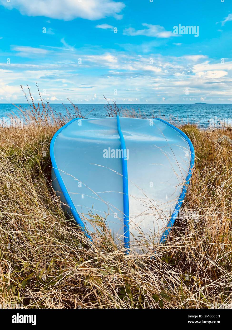 Boat lying on the beach during the summer months Stock Photo - Alamy