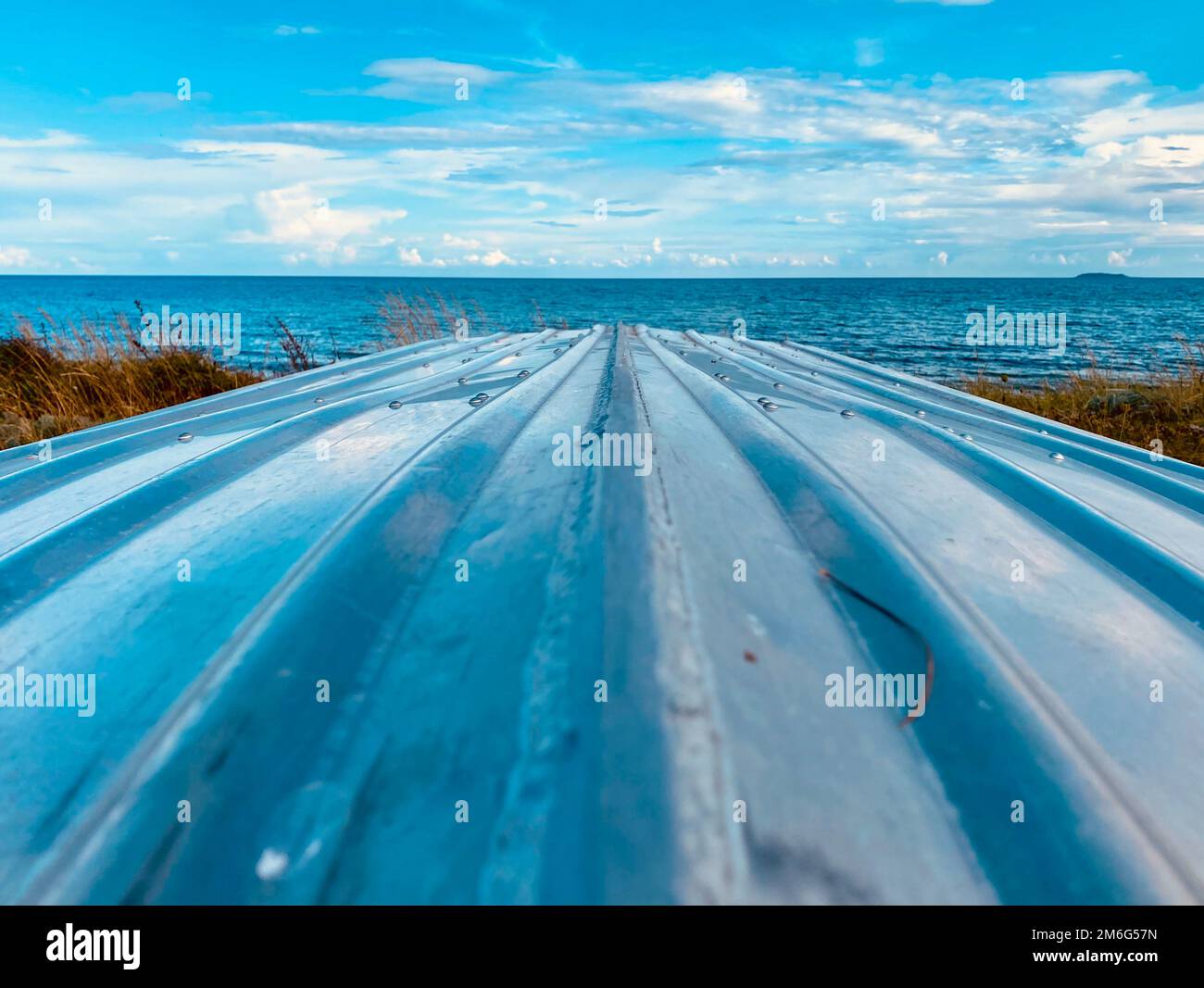 Boat lying on the beach during the summer months Stock Photo - Alamy